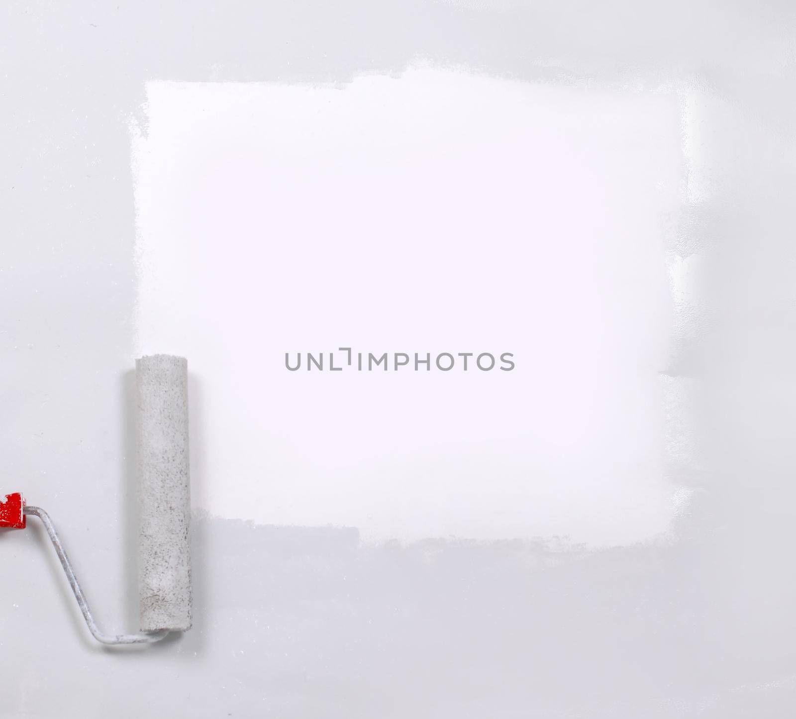 square painted white with the paint roller, on a white sheet of paper.place for text.