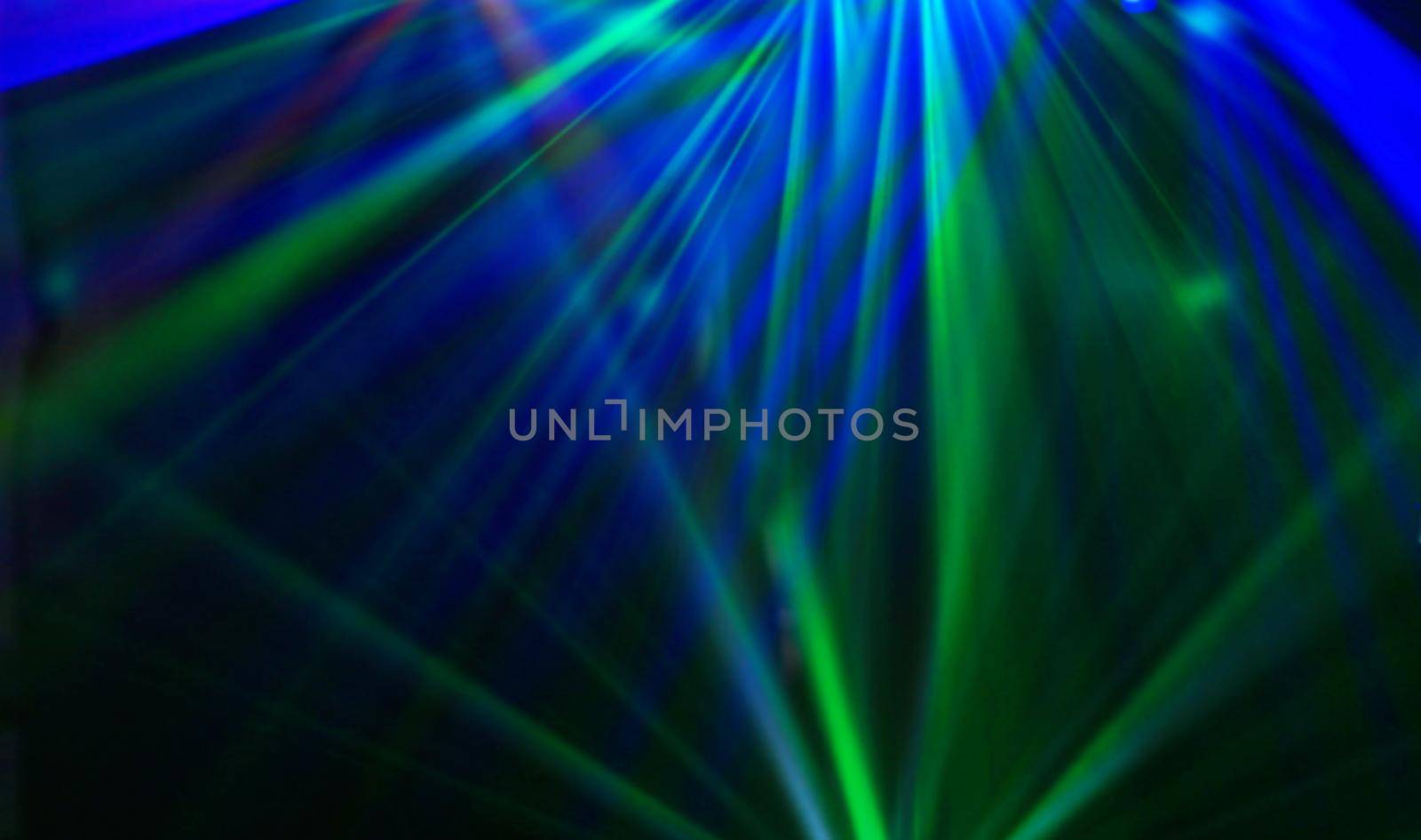 Disco. Laser show. Laser beams at the disco in the blur