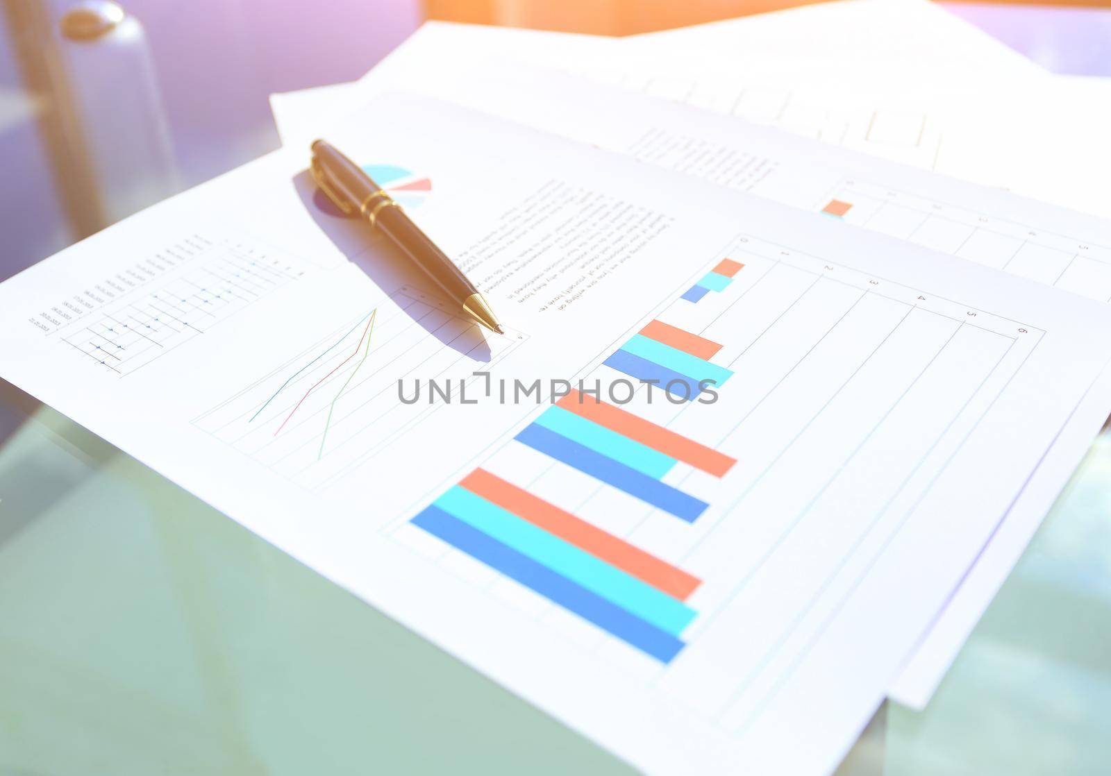 financial and business color charts and graphs on the table