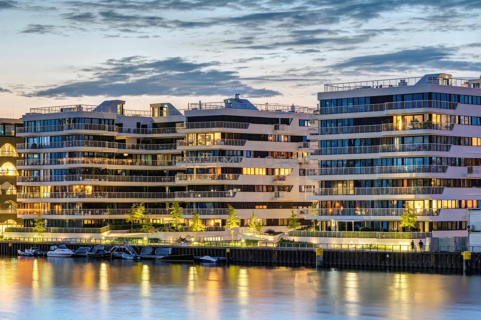 Modern apartment buildings at the river Spree in Berlin at dusk