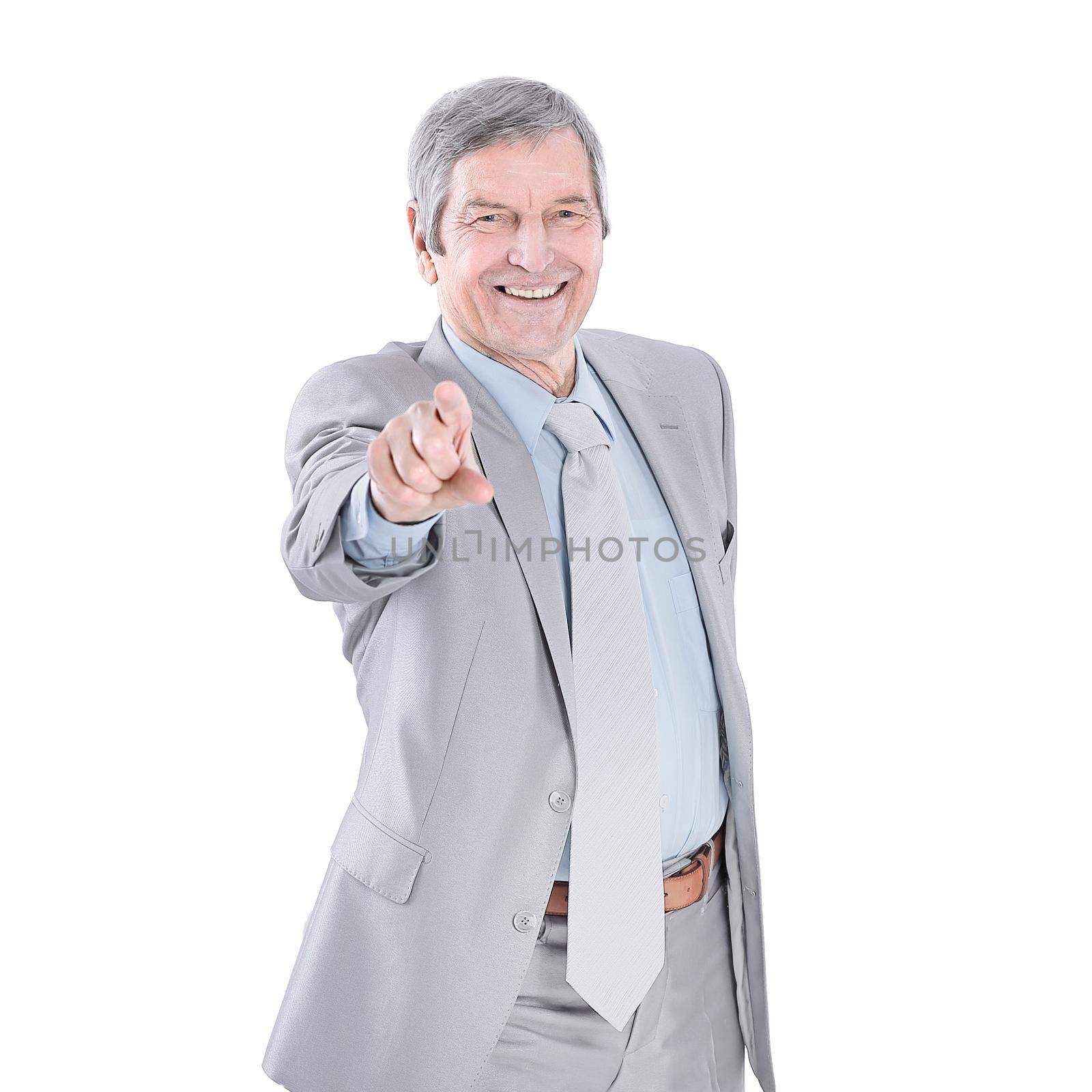 in full growth . Mature businessman pointing forward.isolated on white.photo with copy space