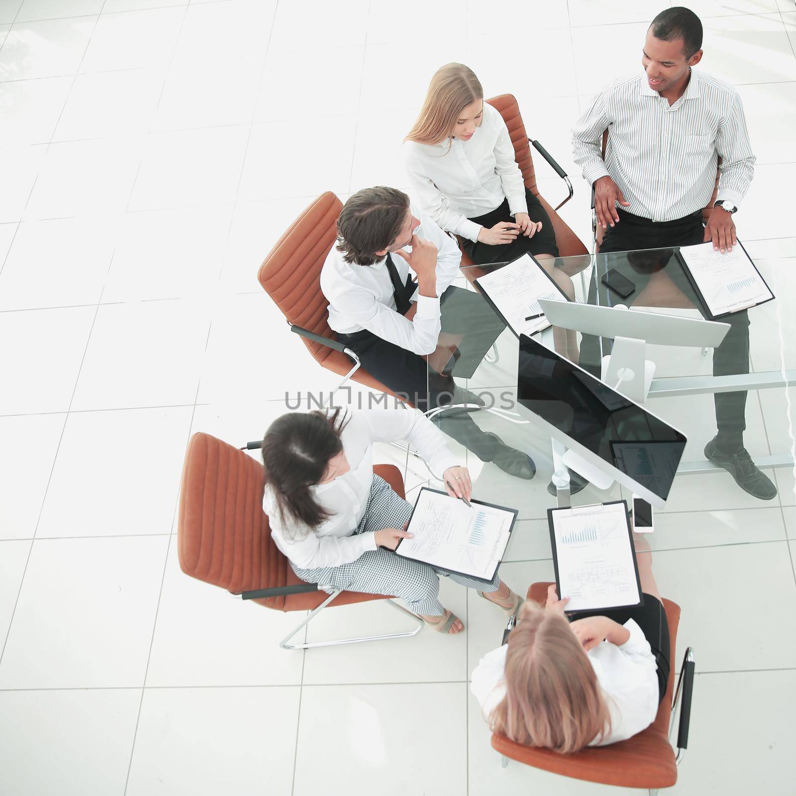 top view.business team discussing financial documents. photo with copy space by SmartPhotoLab