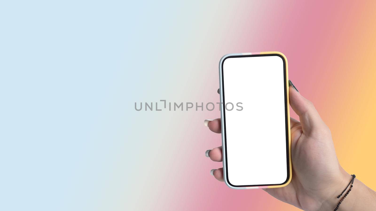 Woman hand holding smart phone isolated on gradient colorful pastel background. Empty display for graphic display montage.