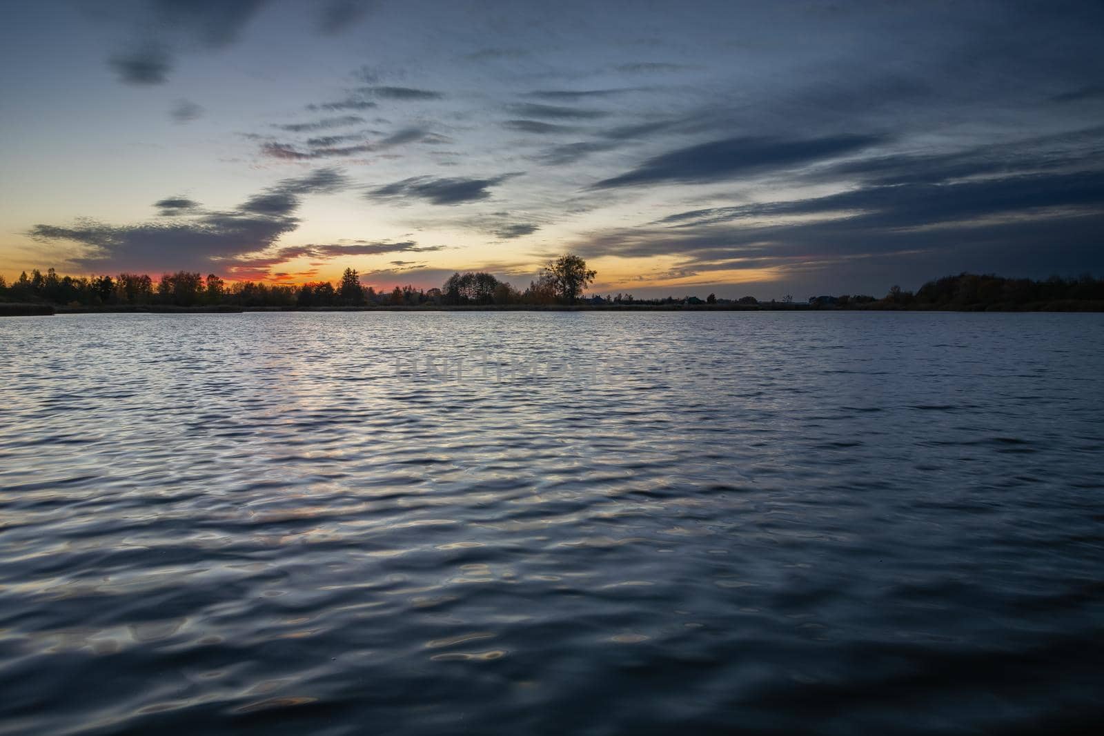 Evening sky and clouds over a calm lake, Stankow, Poland