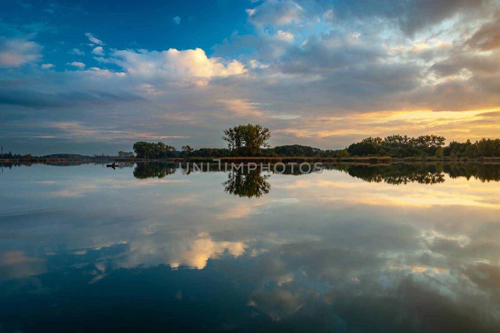 Mirror reflection in the water of evening clouds, Stankow, Poland