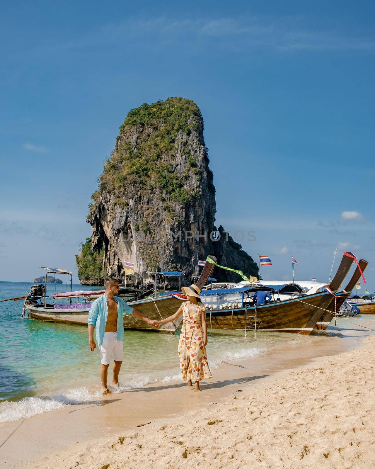 Couple men and woman on vacation in Southern Thailand by fokkebok