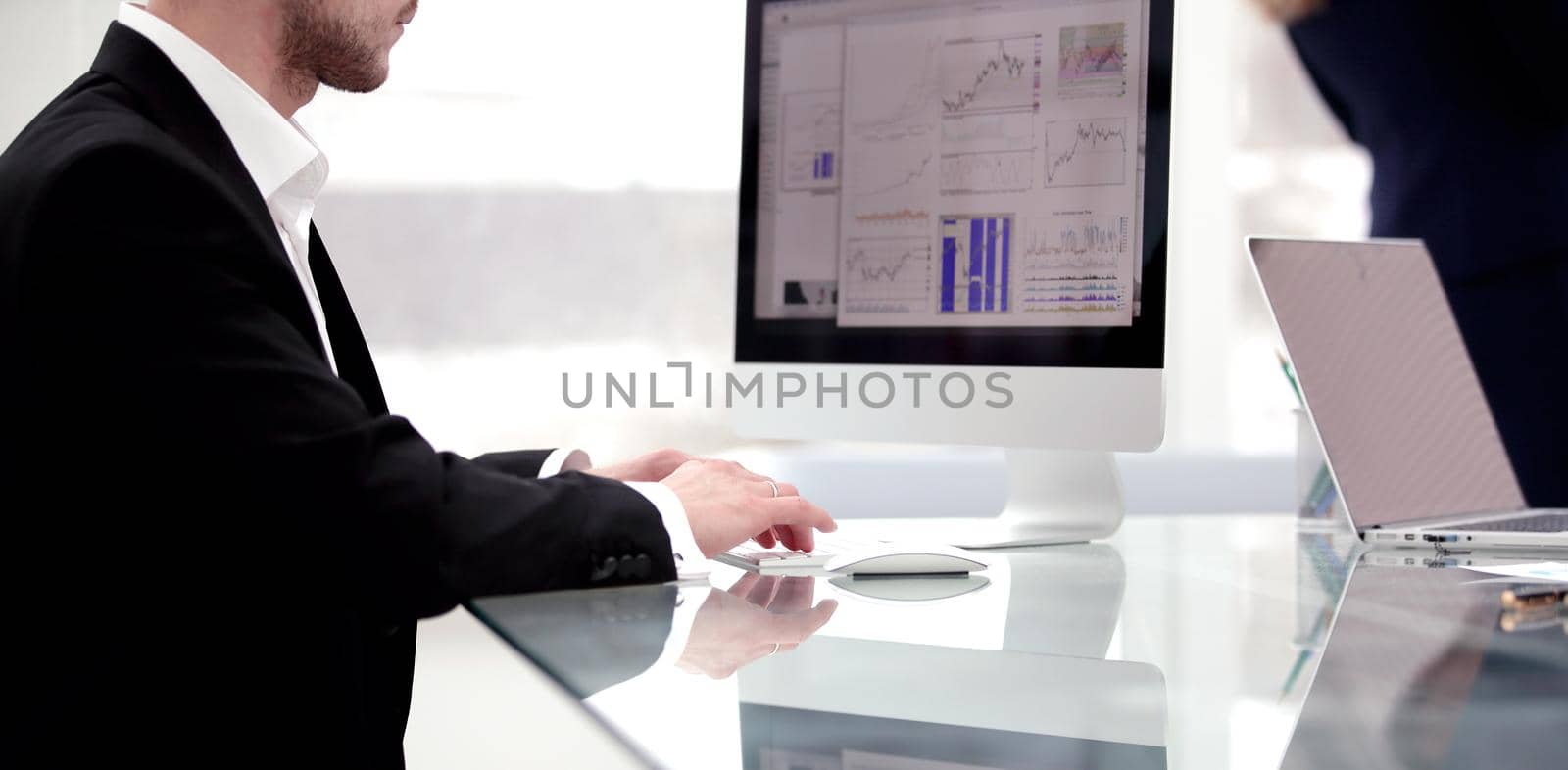 close up.young businessman working with financial charts.photo with copy space