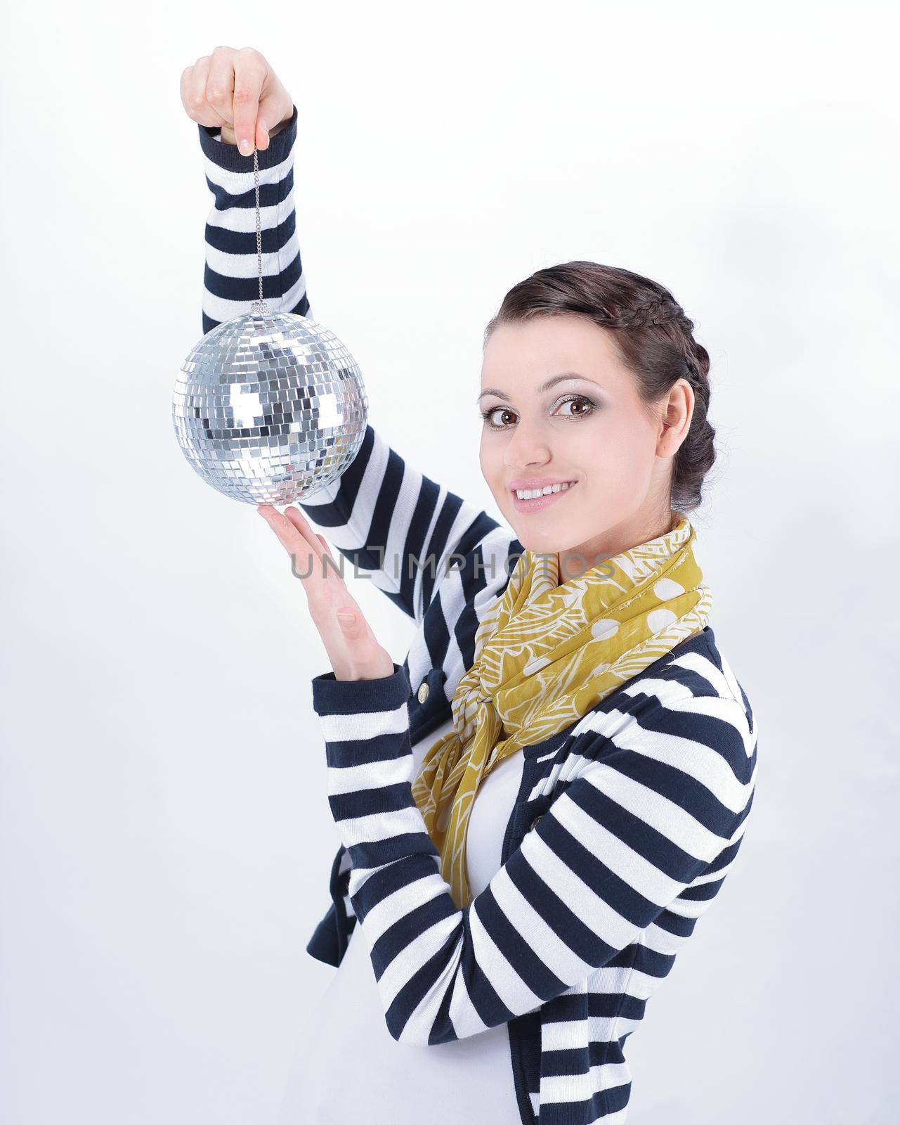 pretty young woman holding a mirror ball.isolated on white background
