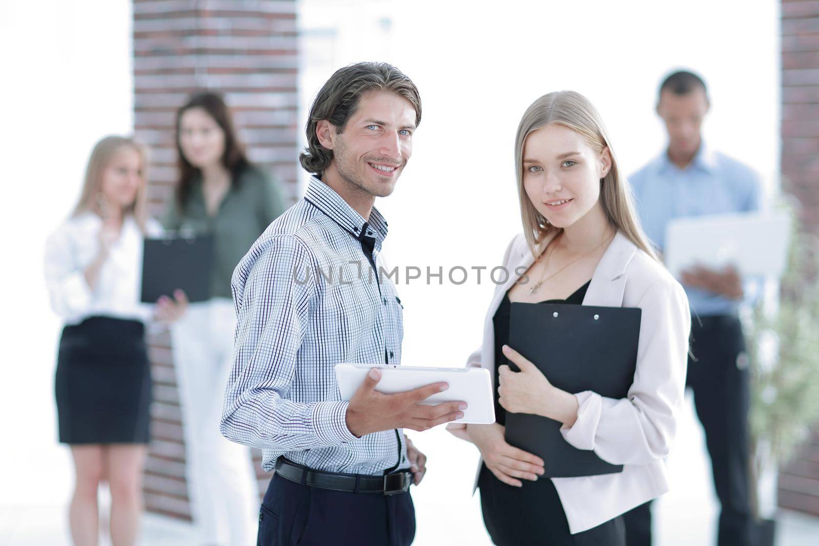 business colleagues looking at digital tablet screen .photo with copy space