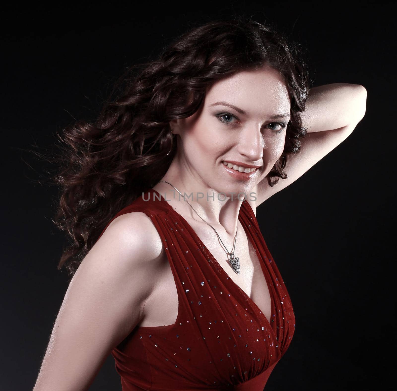 closeup. portrait of beautiful woman with evening make-up .isolated on black background