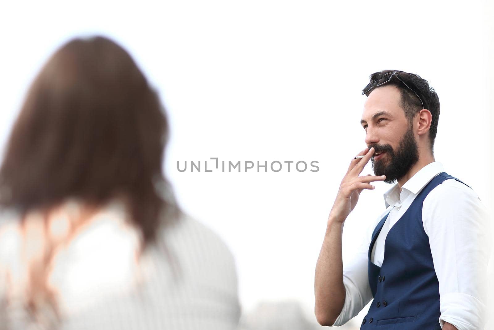 close up.businessman Smoking while standing near an office window . photo with copy space