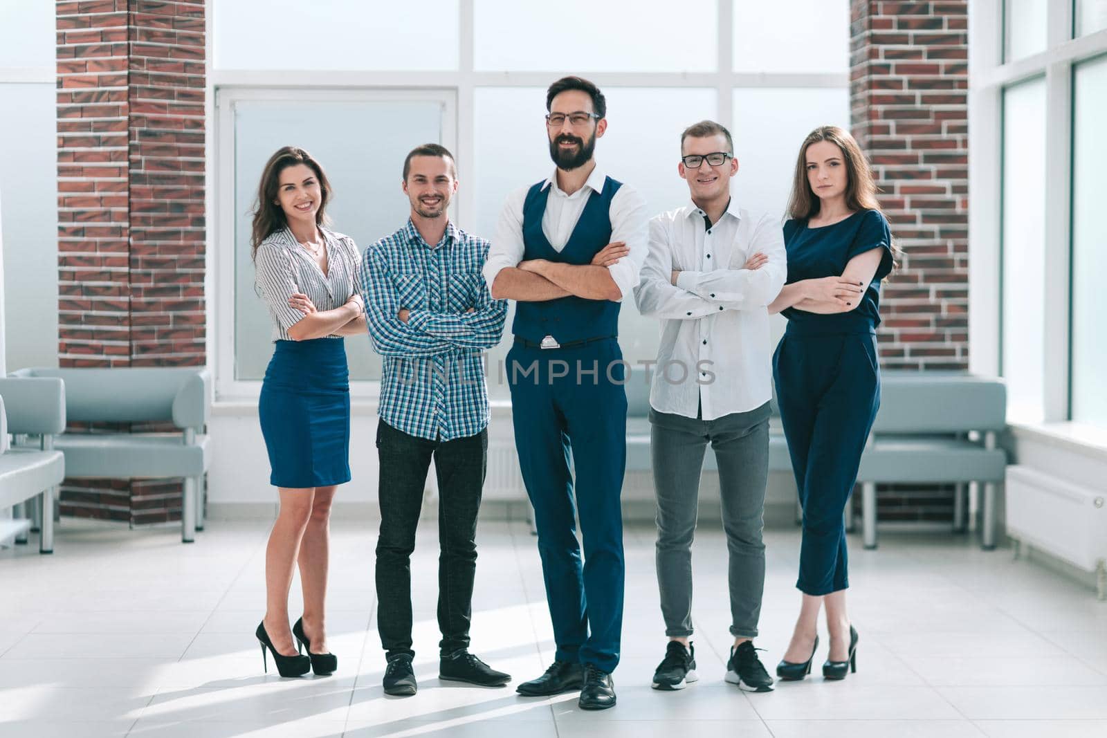 in full growth.professional business team standing in spacious office