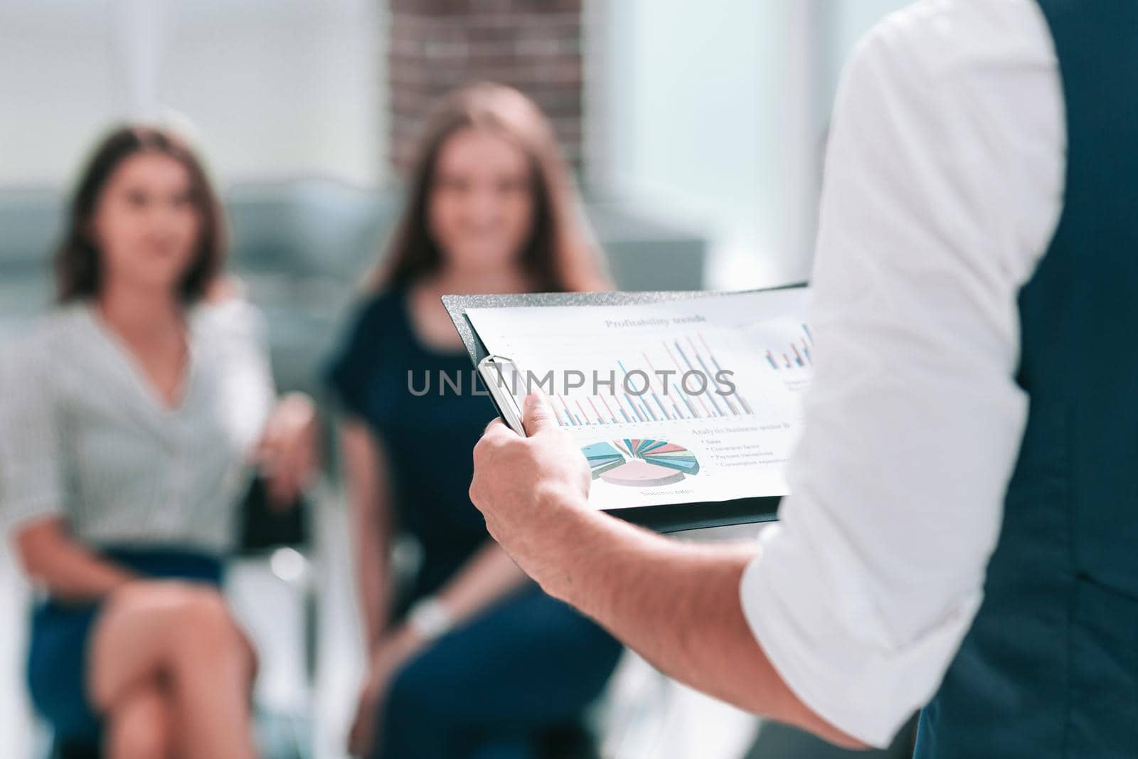 businessman with a financial report at a working meeting. business concept