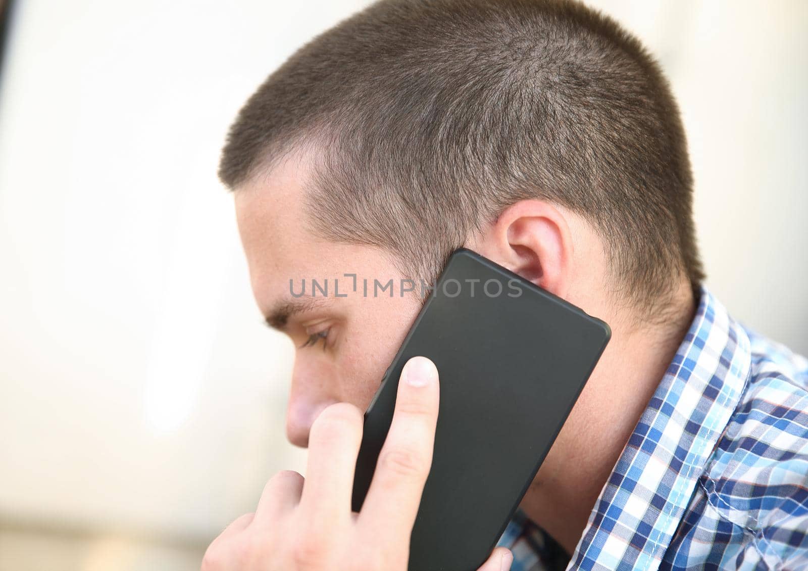 close up.a business man uses a smartphone to discuss important issues.people and technology