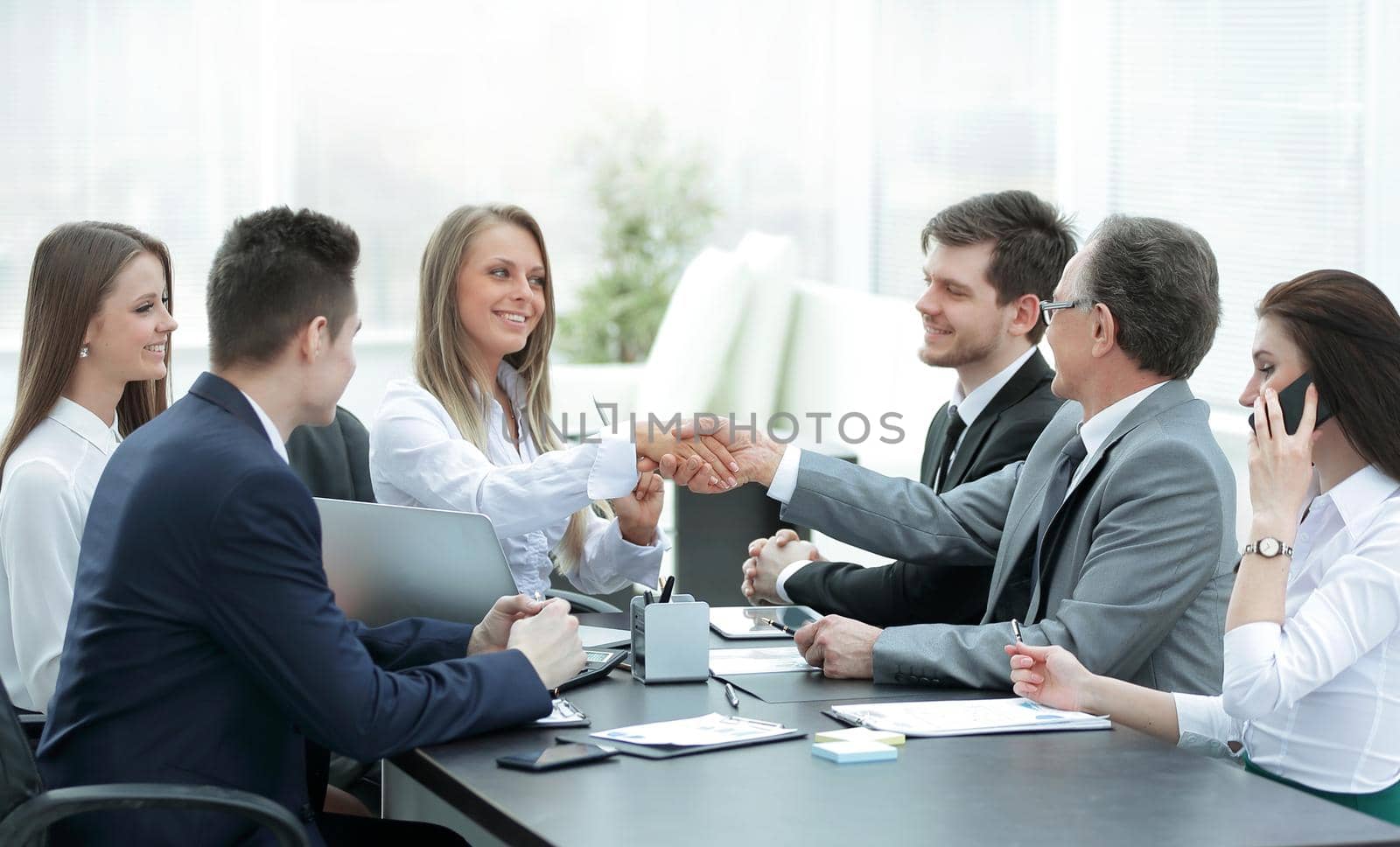 business partners shaking hands after a successful transaction.concept of partnership