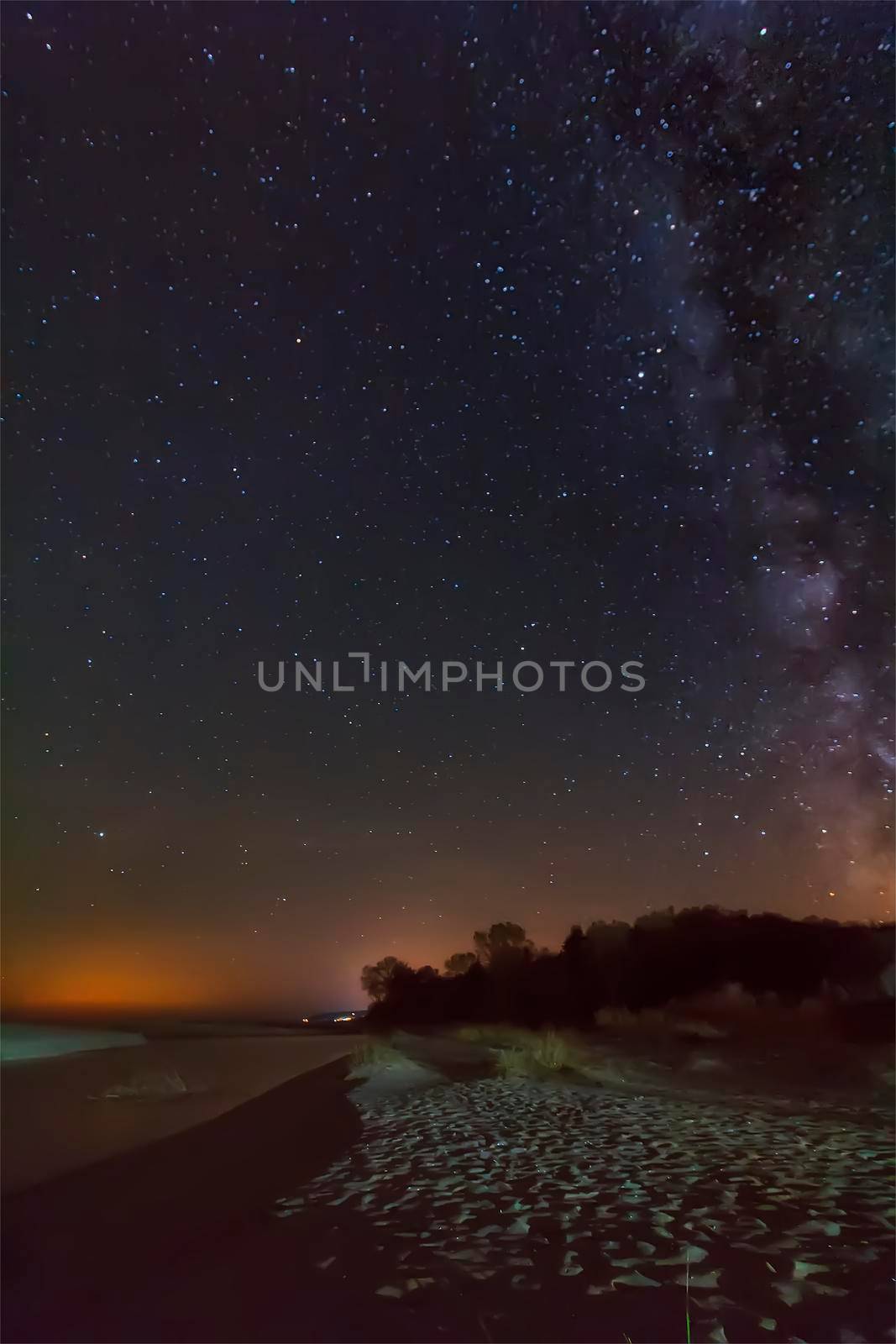 night sky with stars and milky way over beach by EdVal