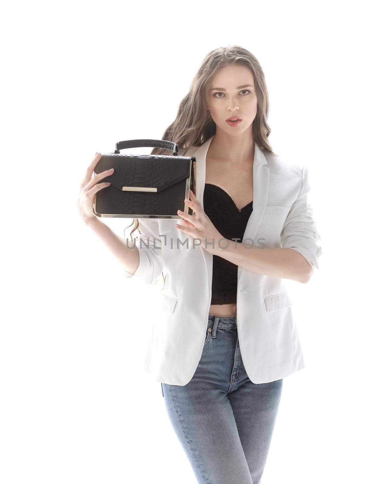 stylish young woman showing her fashionable handbag.isolated on white.