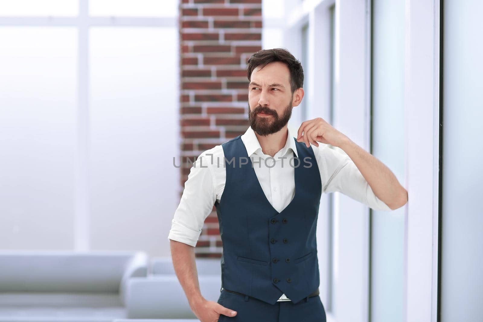 modern businessman standing in a bright office. photo with copy space
