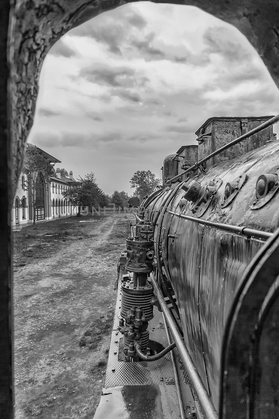 Old steam locomotive window with a view of outside. Black and white by EdVal