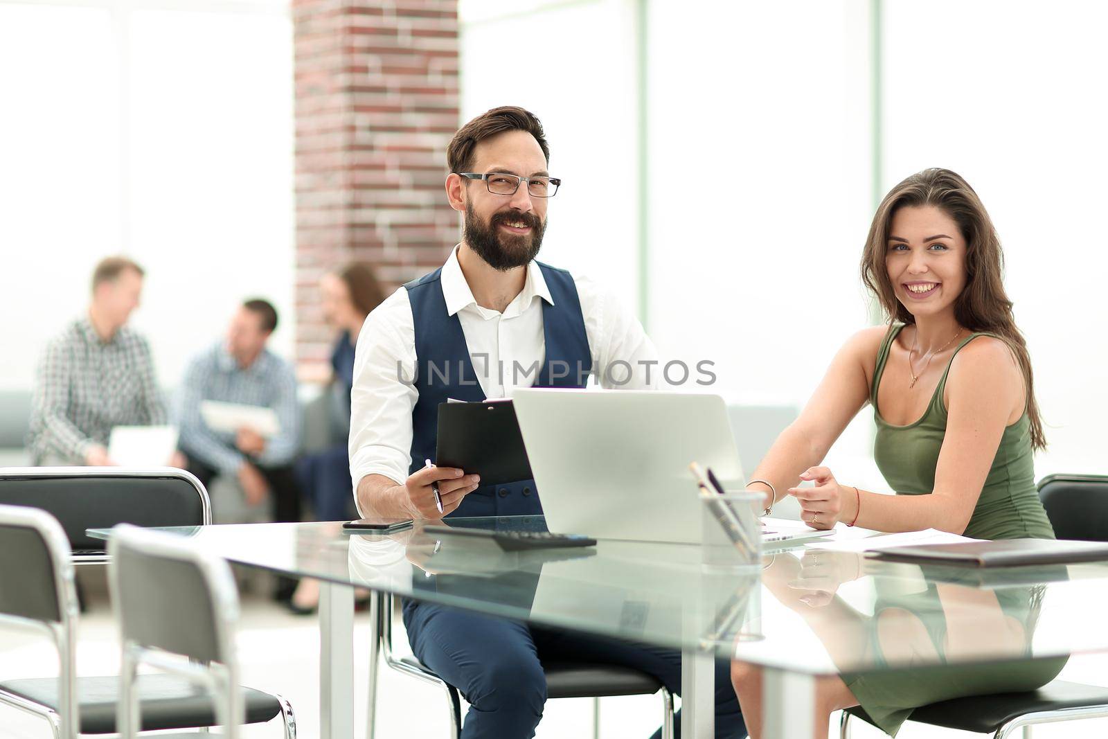 business colleagues sitting at their Desk in the office.the concept of a startup