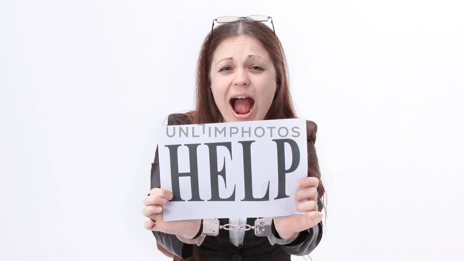 young business woman asks for help,sitting behind a Desk.isolated on white.