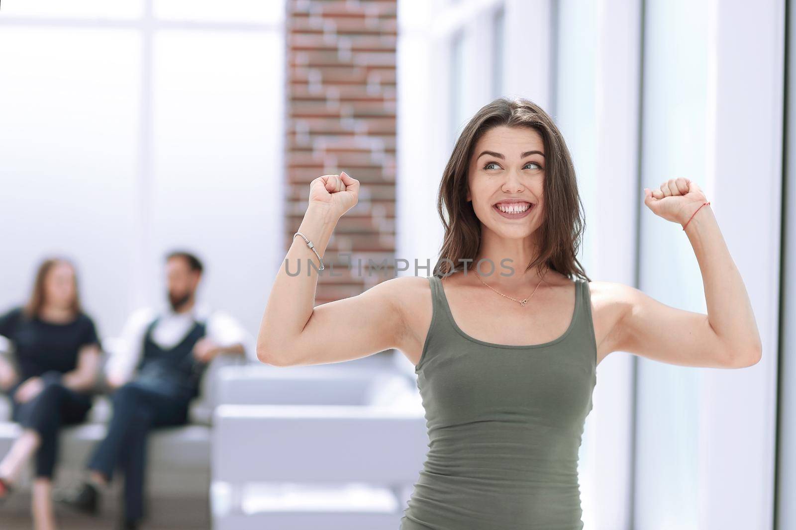 happy young lady standing in Bank office.photo with copy space