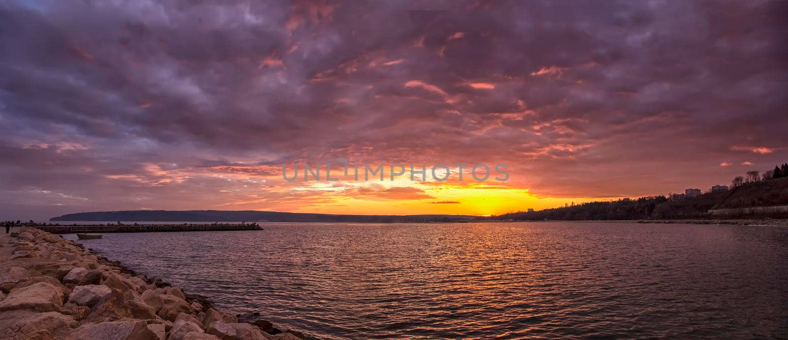 Scenic view of beautiful sunset above the horizon. Stunning sky clouds in the sunset.
