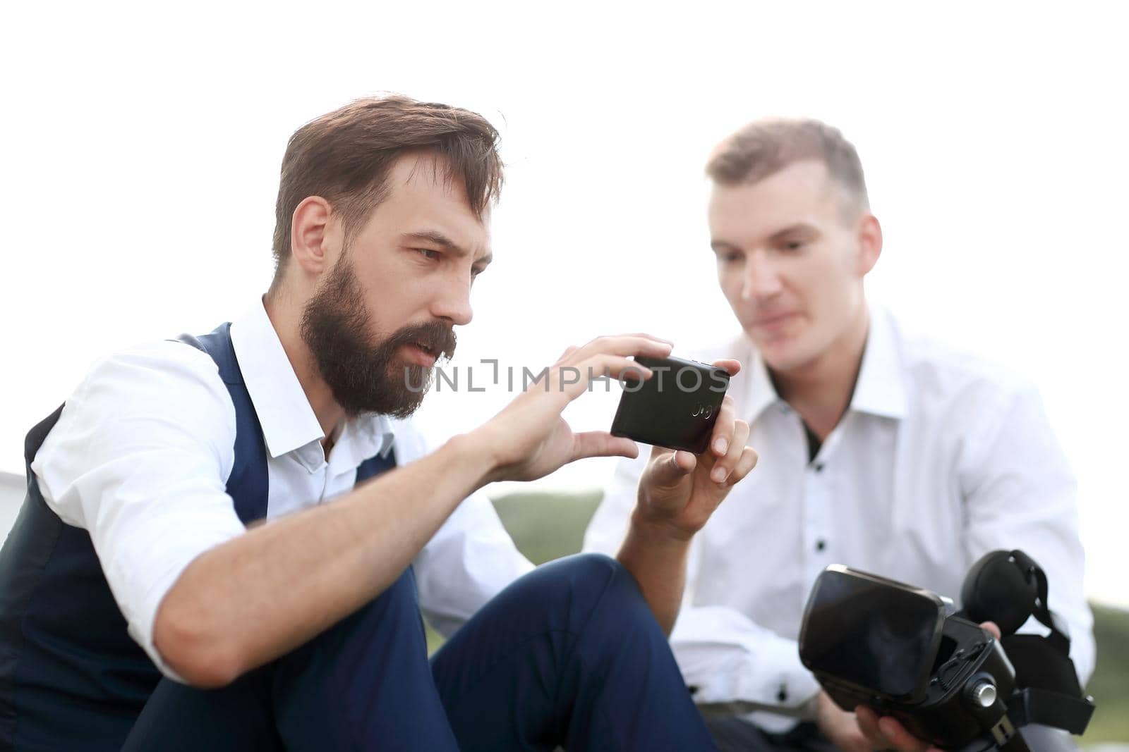 close up. modern man taking selfies outdoors by SmartPhotoLab