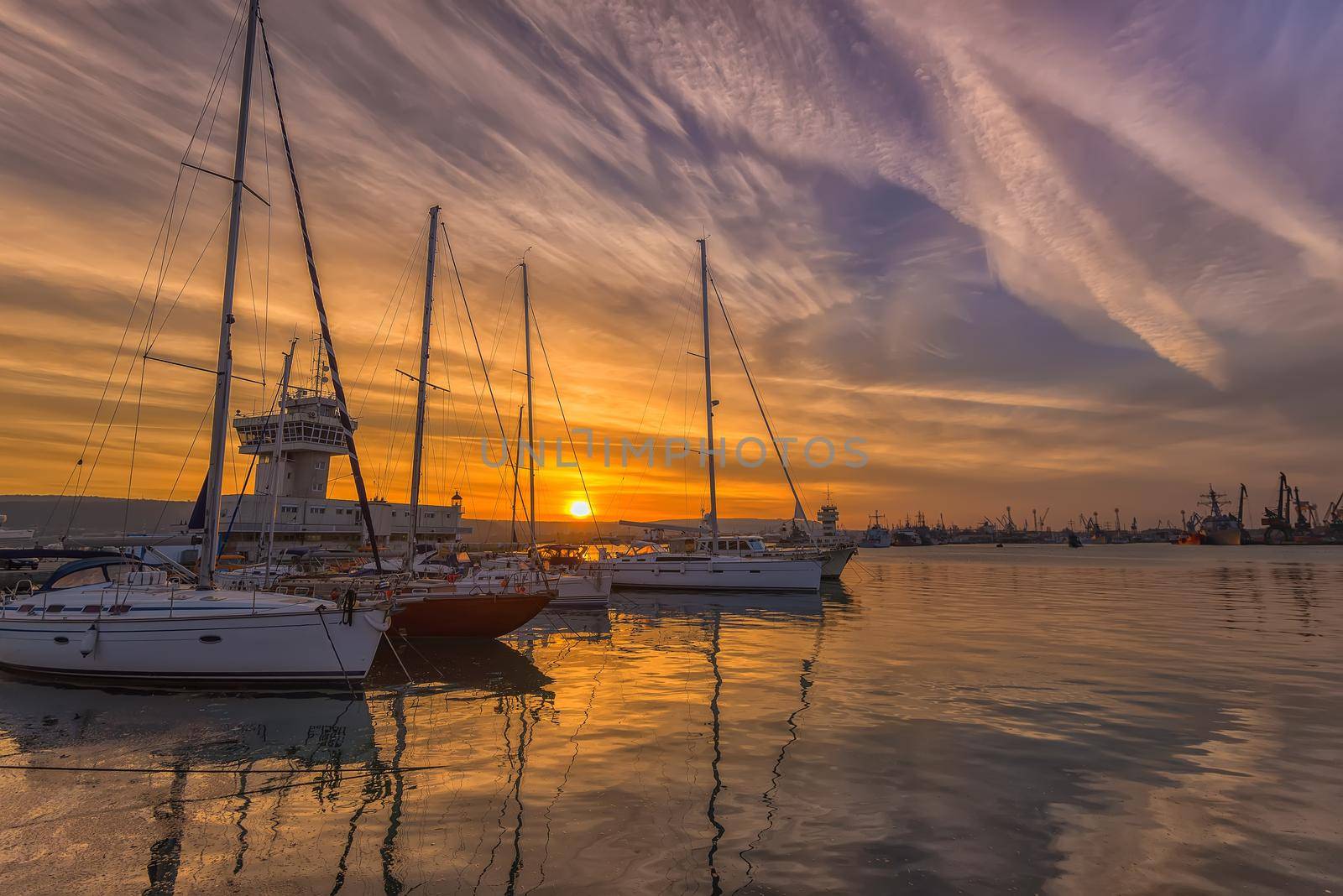 Yachts and boats at sunset in the harbor. Black sea, Varna, Bulgaria.