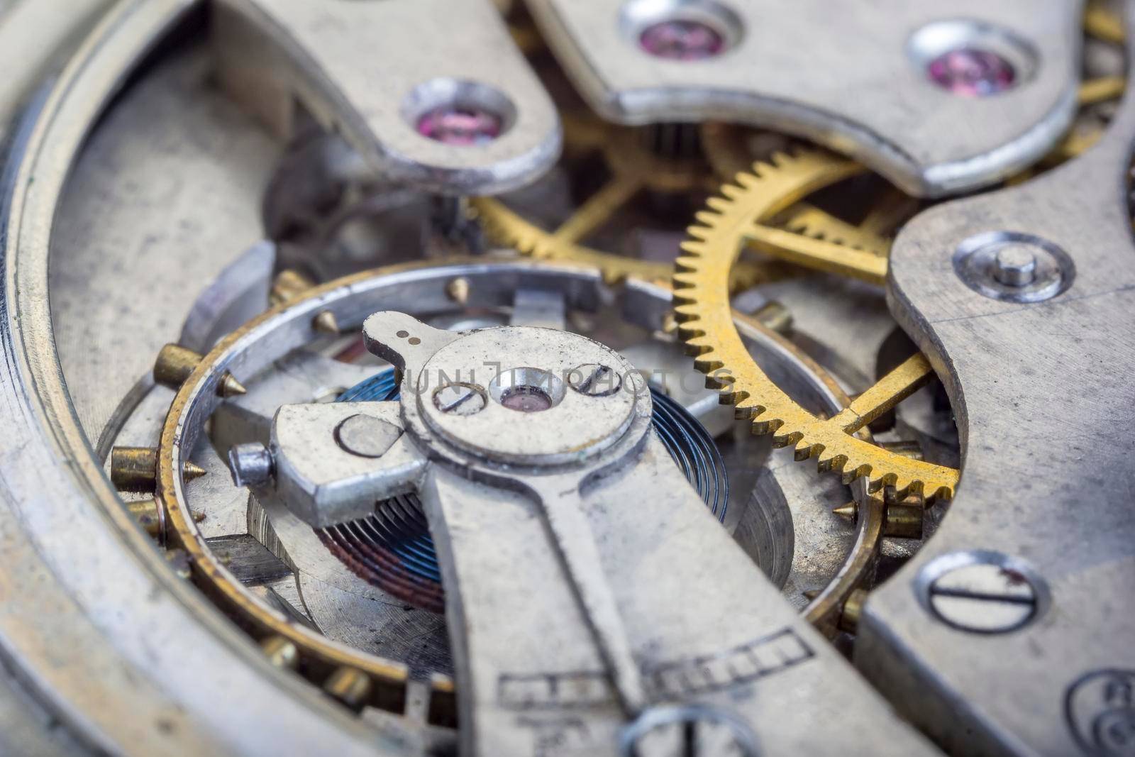 Macro shot of clockwork gears inside the old watch