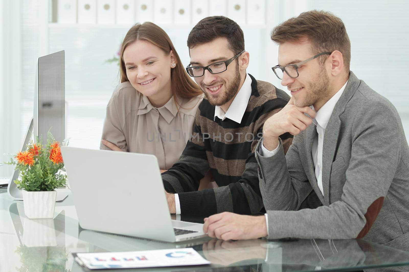 smiling business team sitting at the Desk .photo with copy space.
