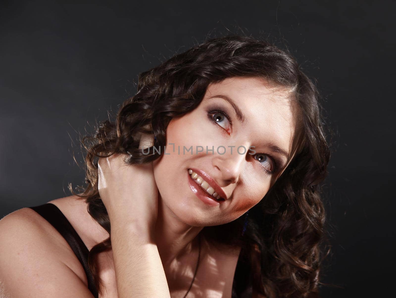 closeup portrait of a beautiful young woman. .isolated on black background