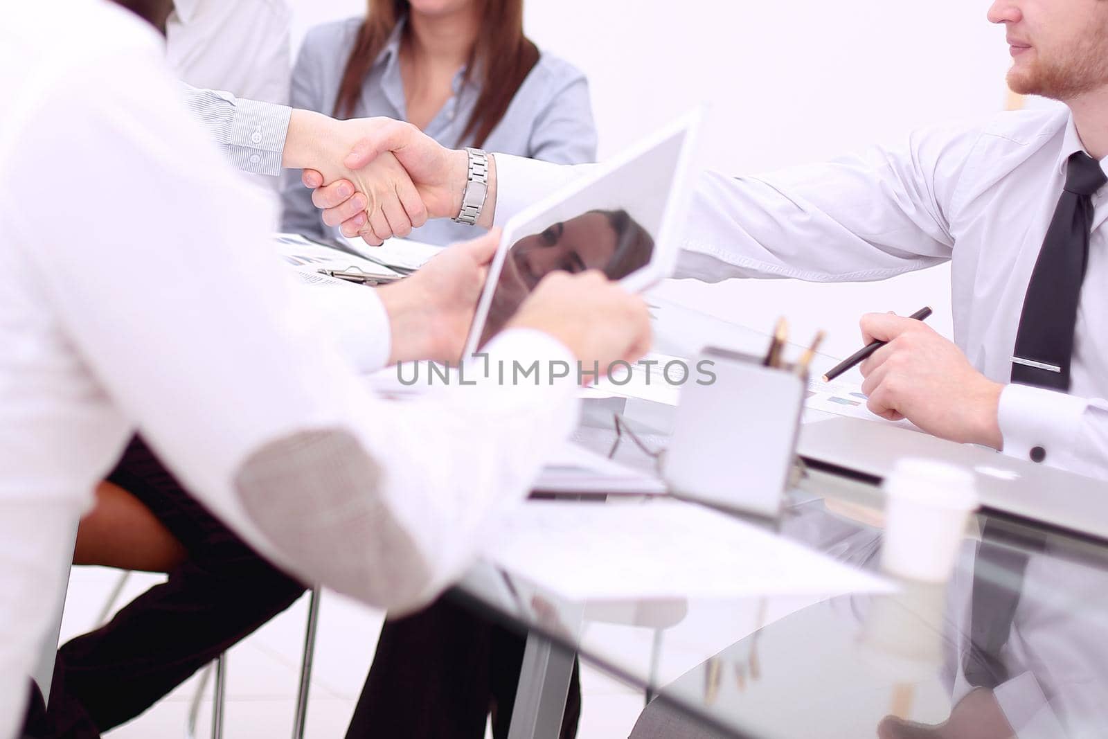 business handshake of business people at the office Desk.