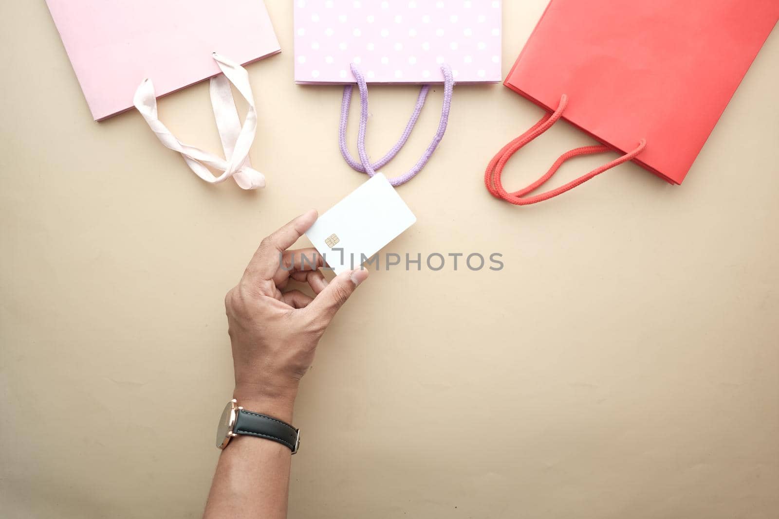 top view of person hand holding credit card.