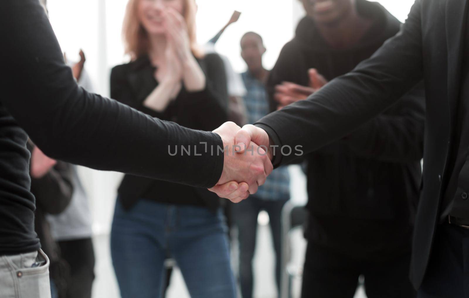 group of happy young people applauding their leaders. the concept of success