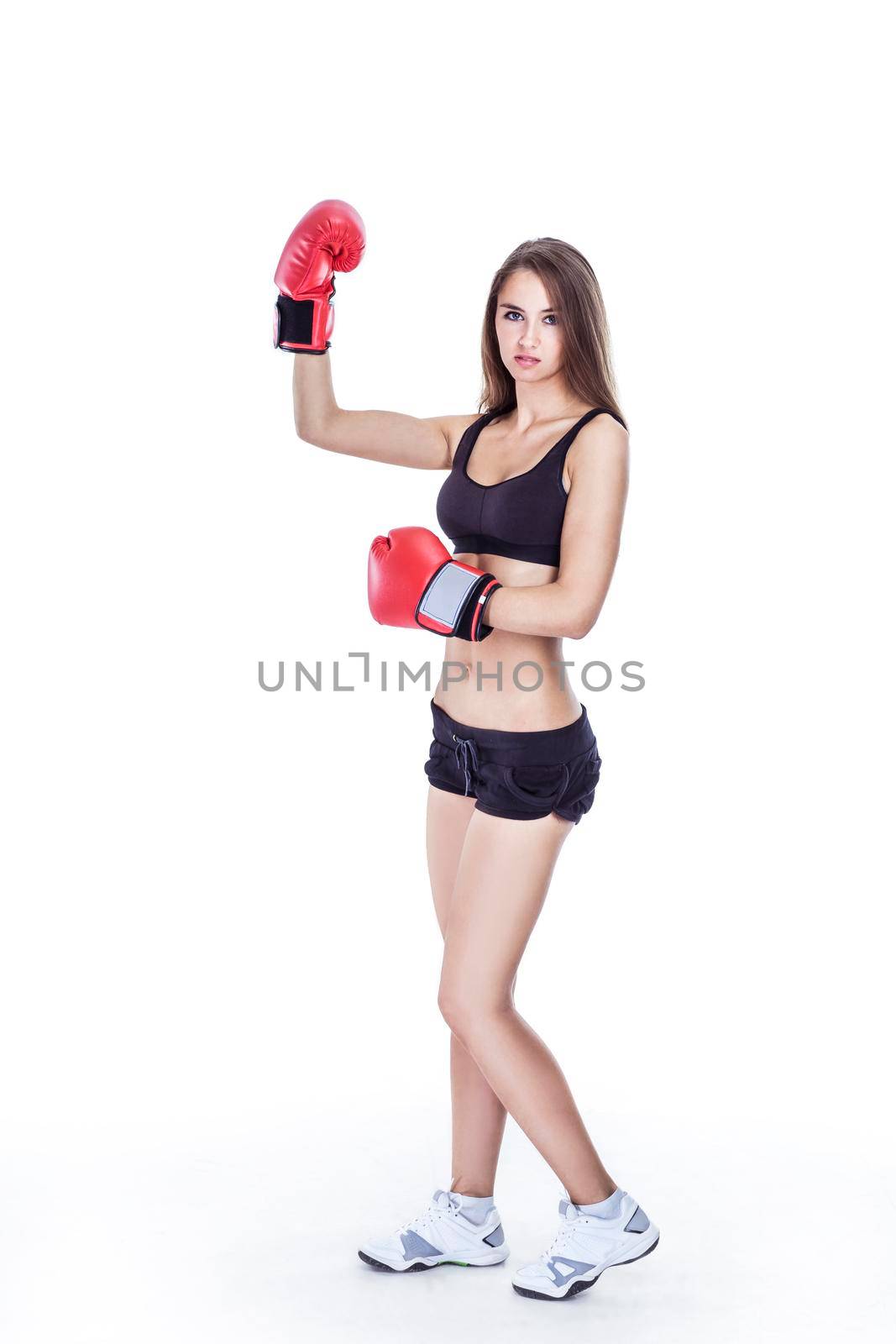 sporty woman in red Boxing gloves.a healthy way of life.beauty and sport.the photo has a blank for text