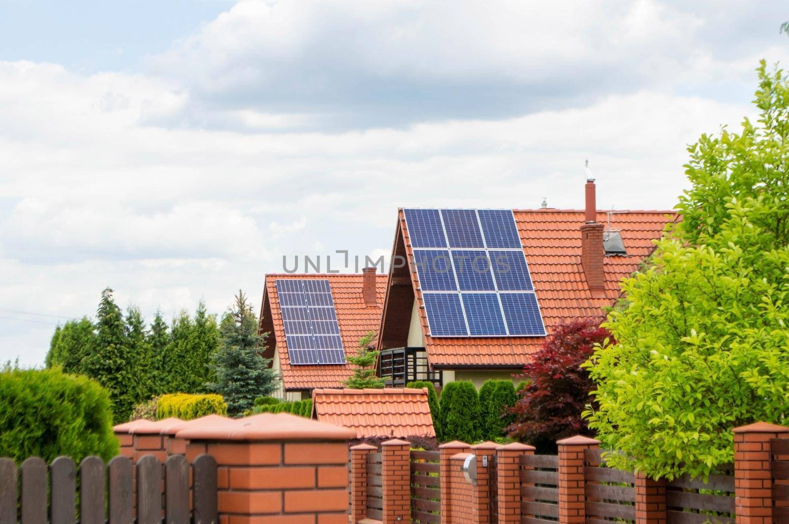 Historic farm house with modern solar panels on roof and wall High quality photo