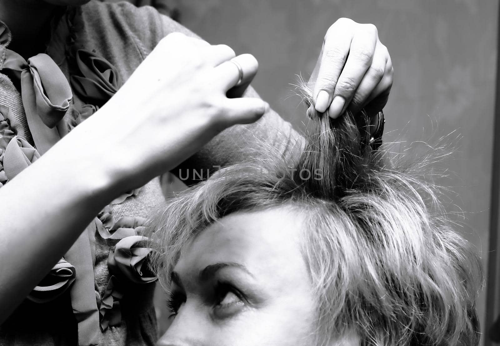 beautiful woman sitting in a hair salon.black-and-white photo in retro style