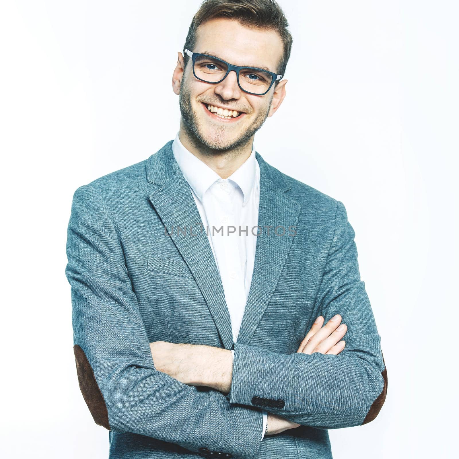 successful Manager in glasses on a light background.the photo has a empty space for your text.