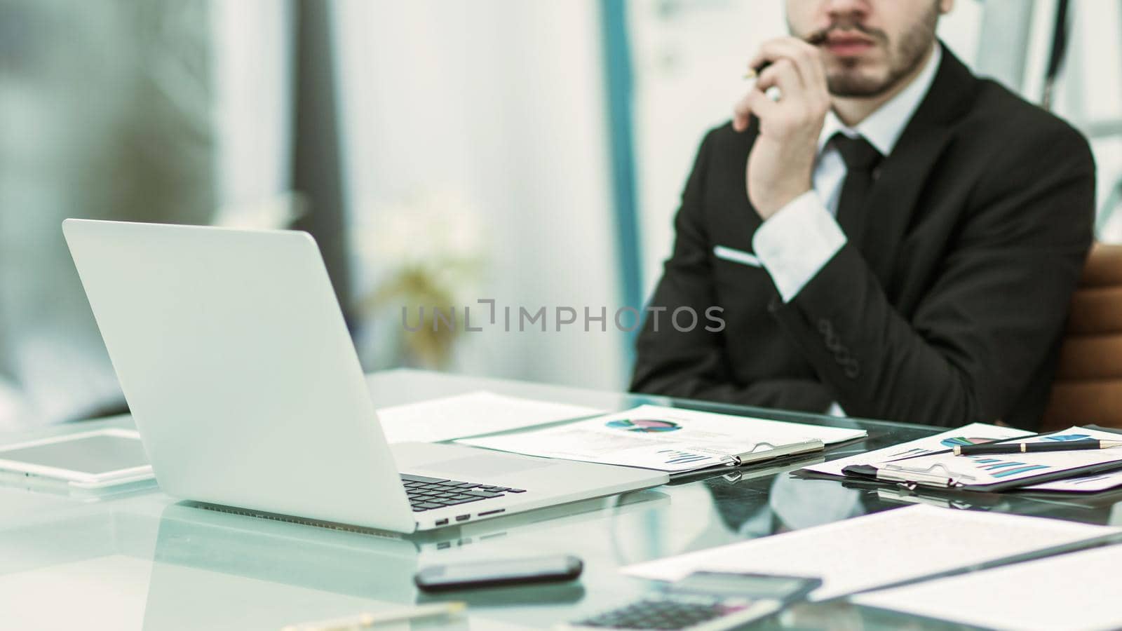 businessman working with financial documents at Desk in modern office