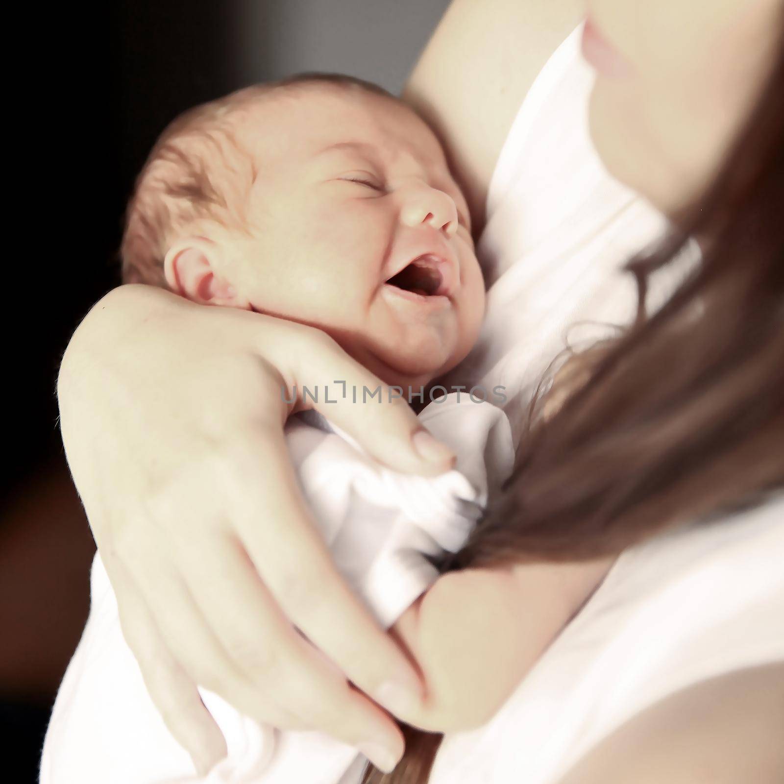 mother with newborn baby in the nursery