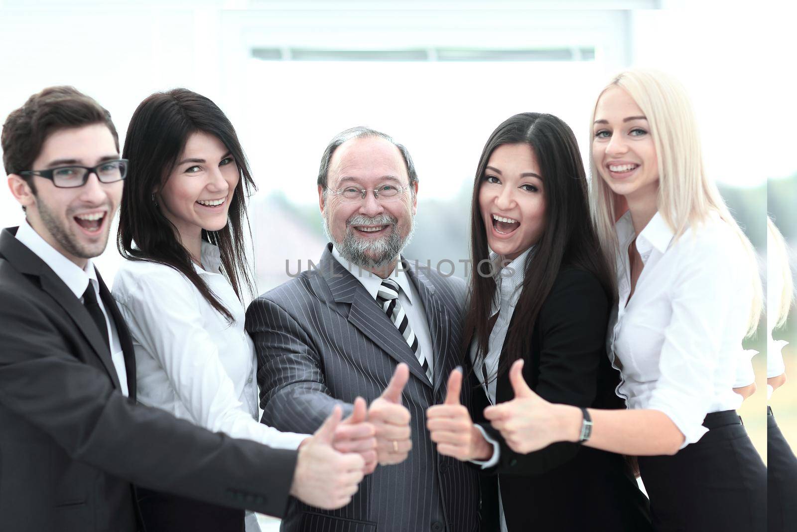 closeup head and business team showing thumb up.concept approval