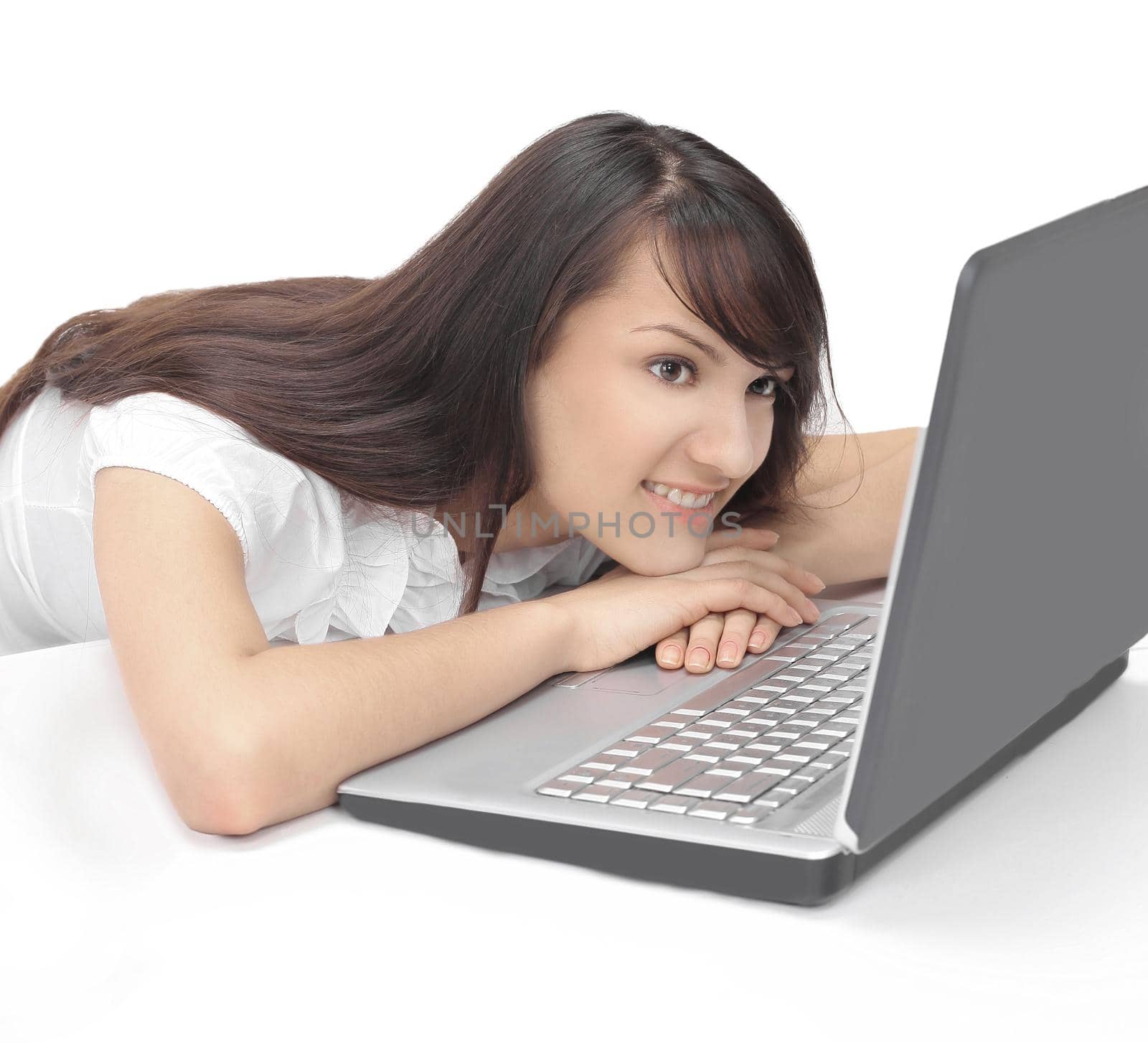closeup. portrait of a young employee behind her Desk.isolated on white