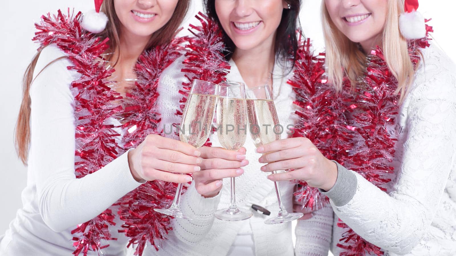 closeup.three young women with glasses of champagne . the concept of Christmas.