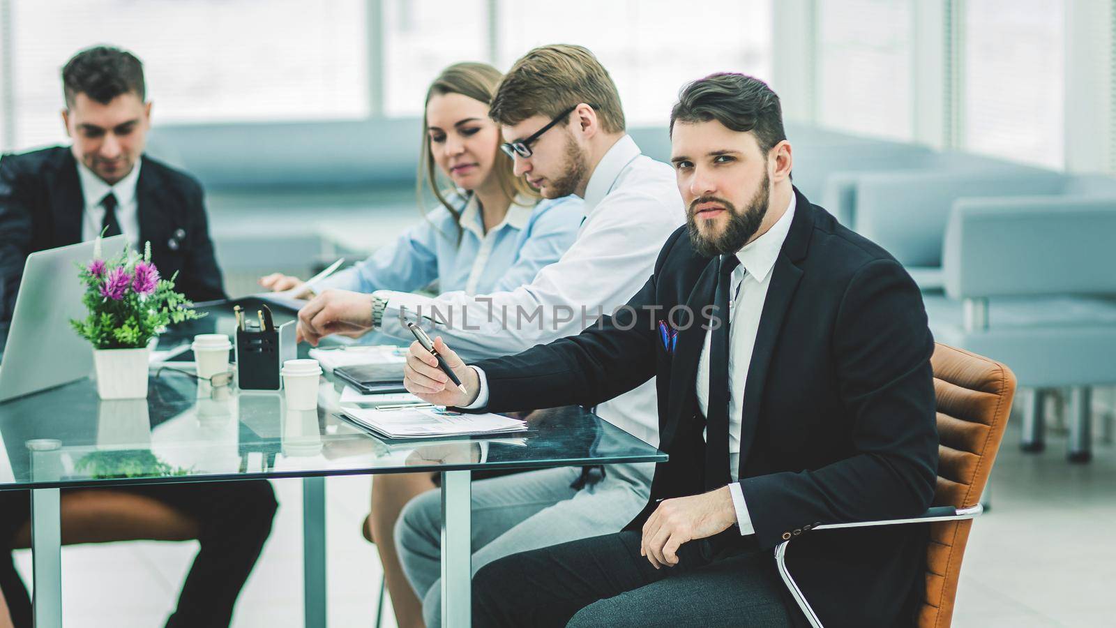 sales Manager and business team are working with financial reports at the workplace in the office.the photo has a empty space for your text