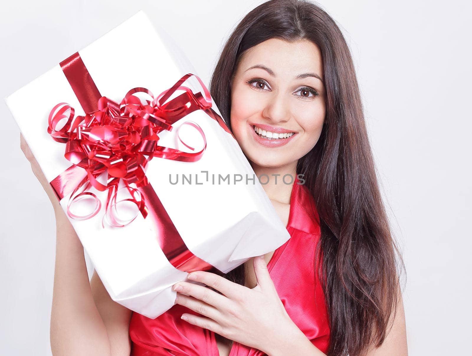closeup. happy beautiful woman kissing her a gift.photo with copy space.