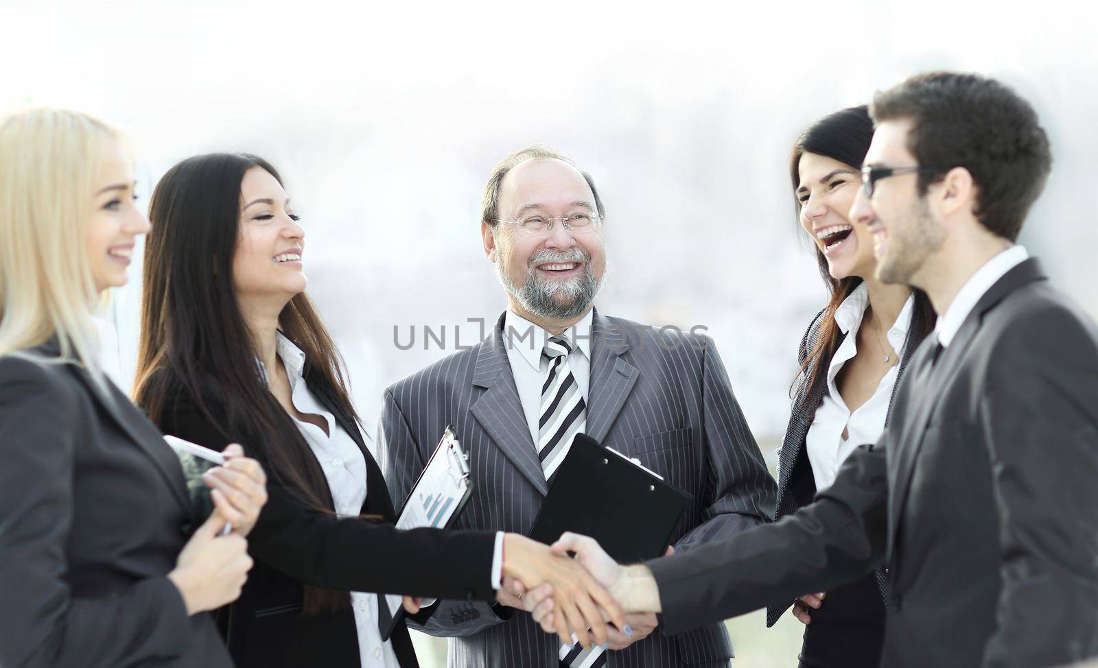 professional business team and shaking hands of young business partners in the office.photo with place for text
