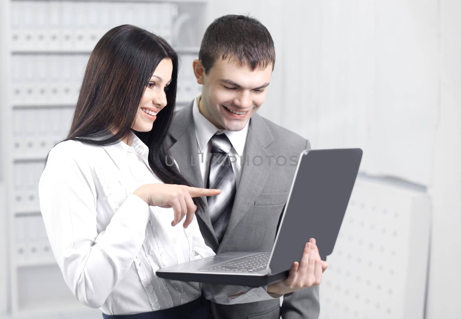 employees communicating on the Internet using laptop.photo with copy space