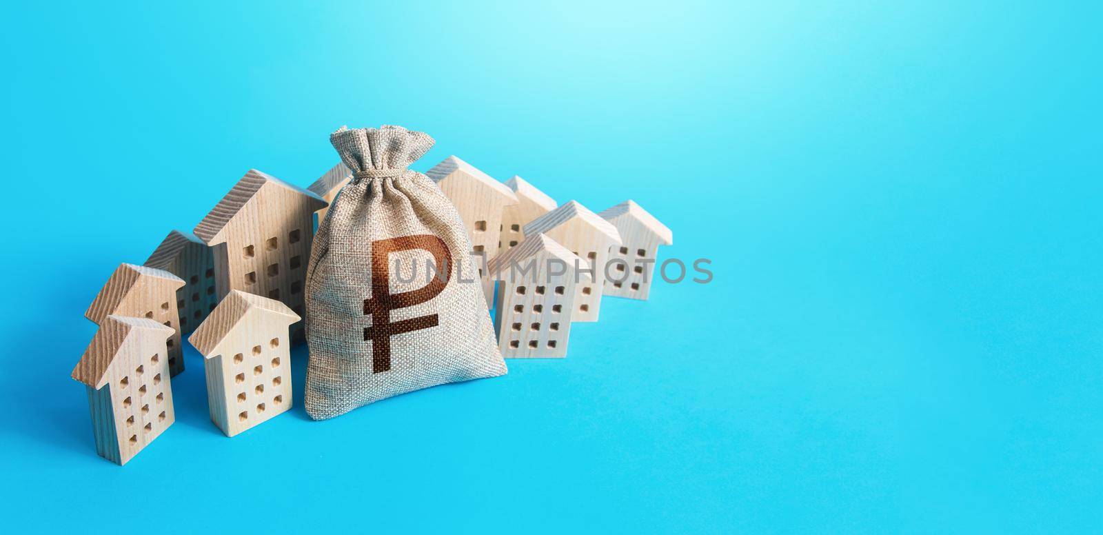 Russian ruble money bag surrounded by houses. Real estate investment. Mortgage loan. Budget and funding. Construction industry. Property insurance. Housing appraisal. Valuation. Buying apartments.