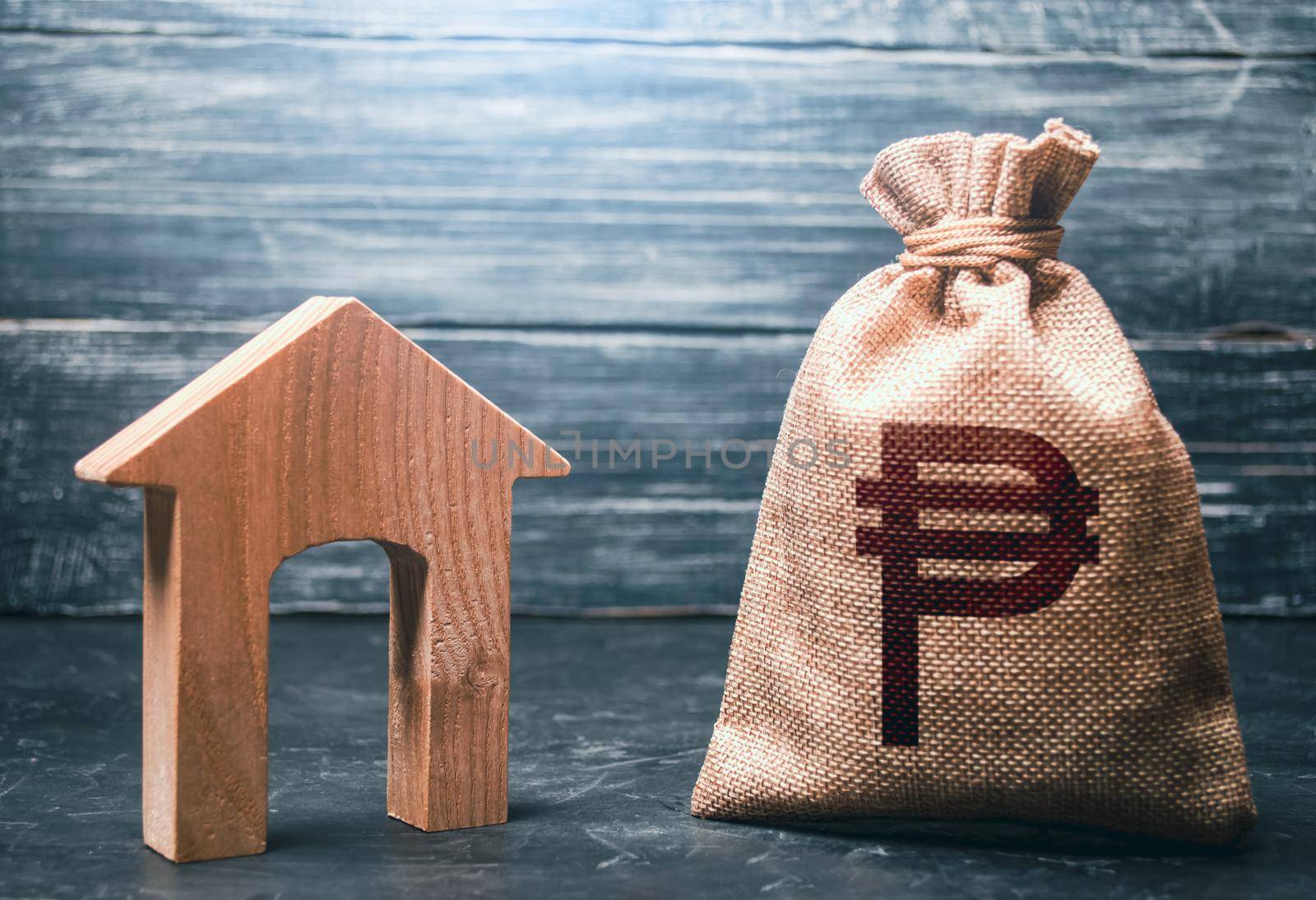 Wooden house and a philippine peso money bag. Mortgage loan. House project development. Rental business. Realtor services. Generating income from rent or sale. Home purchase, investment in real estate by iLixe48